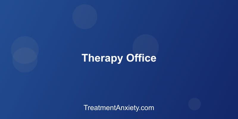 A warm, welcoming therapy office with comfortable seating and natural light